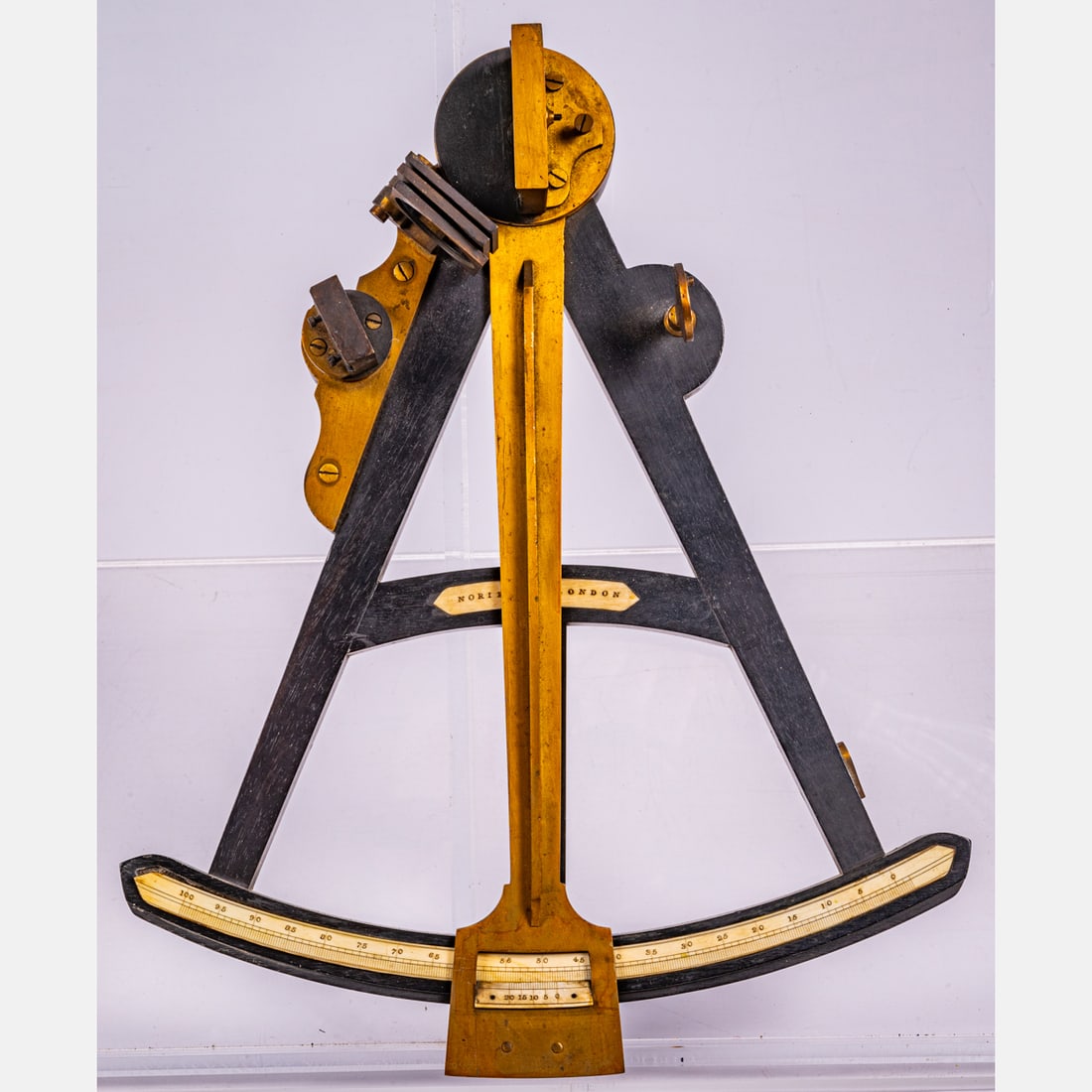 Ebonized Wood and Bronze Octant, Norie and Co. London: An Ebonized Wood and Bronze Octant, Norie and Co. London, 19th Century, In a fitted oak case. Ebonized wood and bronze with bone inlay, central bone plaque inscribed Norie & Co. London. Fitted case ha