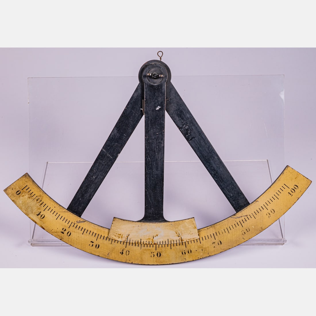 Decorative Painted Wood Octant Sign: A Decorative Painted Wood Octant Sign, 20th Century. H: 2 W: 18 D: 27 1/2 in. From the Estate of John A. Davidson, Jr. Proceeds to benefit the APL of Lorain County and the Dittrick Museum.