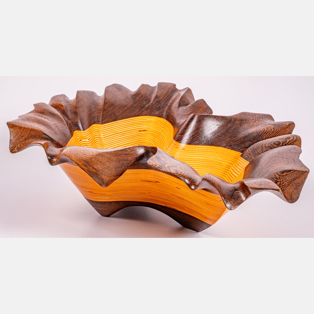 Kerry Vesper Exotic Wood Center Bowl: A Kerry Vesper (American, b. 1945) Exotic Wood Center Bowl, With laminate turned and carved exotic wood, wenge and baltic birch woods. Engraved signature and dated 2006, KV 2450, to underside of botto