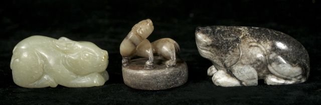 A Group of Three Chinese Carved Jade and Hard Ston: A Group of Three Chinese Carved Jade and Hard Stone Animal Figures Depicting a Rabbit, a Dog, and a Lion. Largest: h: 1.5 x w: 3 x d: 1.25 inches.