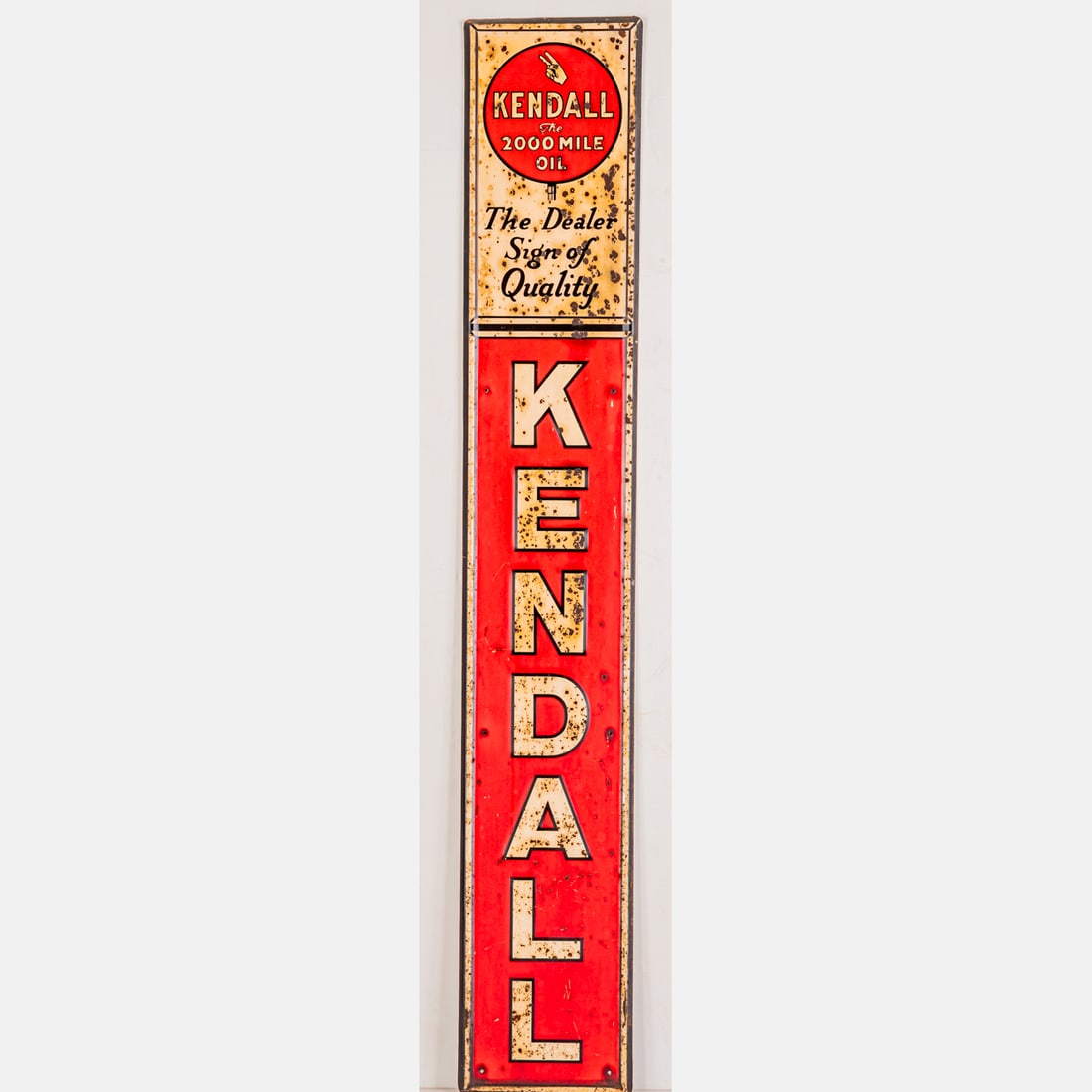 Kendall Motor Oil Sign: Kendall Motor Oil Sign, Mid 20th Century, An embossed metal sign advertising Kendall Motor Oil. Text reads: Kendall The 2000 Mile Oil. The Dealer Sign of Quality. Marked G 62. H: 71 1/2 W: 11 3/4 in. 