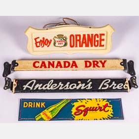 A Group Of Gas Station Beverage Advertising Signs