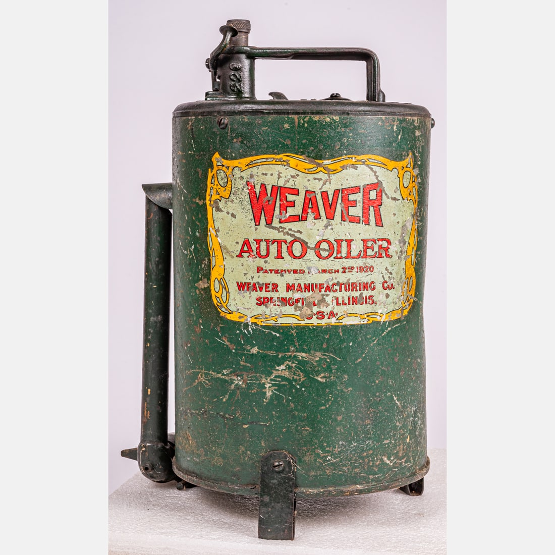 Weaver Auto Oiler Oil Can: Weaver Auto Oiler Oil Can, ca. 1920's, Five gallon can for Weaver Auto Oiler, Patented March 2nd, 1920. Weaver Manufacturing Co. Springfield, Illinois. Green painted cylindrically shaped can with a ha