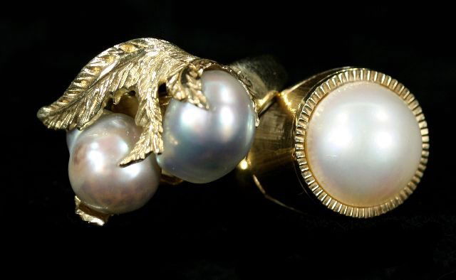 Two 10kt. and 14kt. Yellow Gold and Pearl Rings.: Two 10kt. and 14kt. Yellow Gold and Pearl Rings. Sizes: 5.5 (10kt.) and 6 (14kt.). Total approximate weight: 4.5 dwt. (10kt.) Total approximate weight: 3.0 dwt. (14kt).