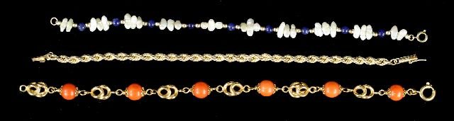 A Group of Three 14kt. Yellow Gold Pearl, Lapis and: A Group of Three 14kt. Yellow Gold Pearl, Lapis and Coral Beaded and Rope Twist Bracelets. Length: 7 in. (each) Total approximate weight: 6.5 dwt. (coral) Total approximate weight: 2.9 dwt. (rope twis