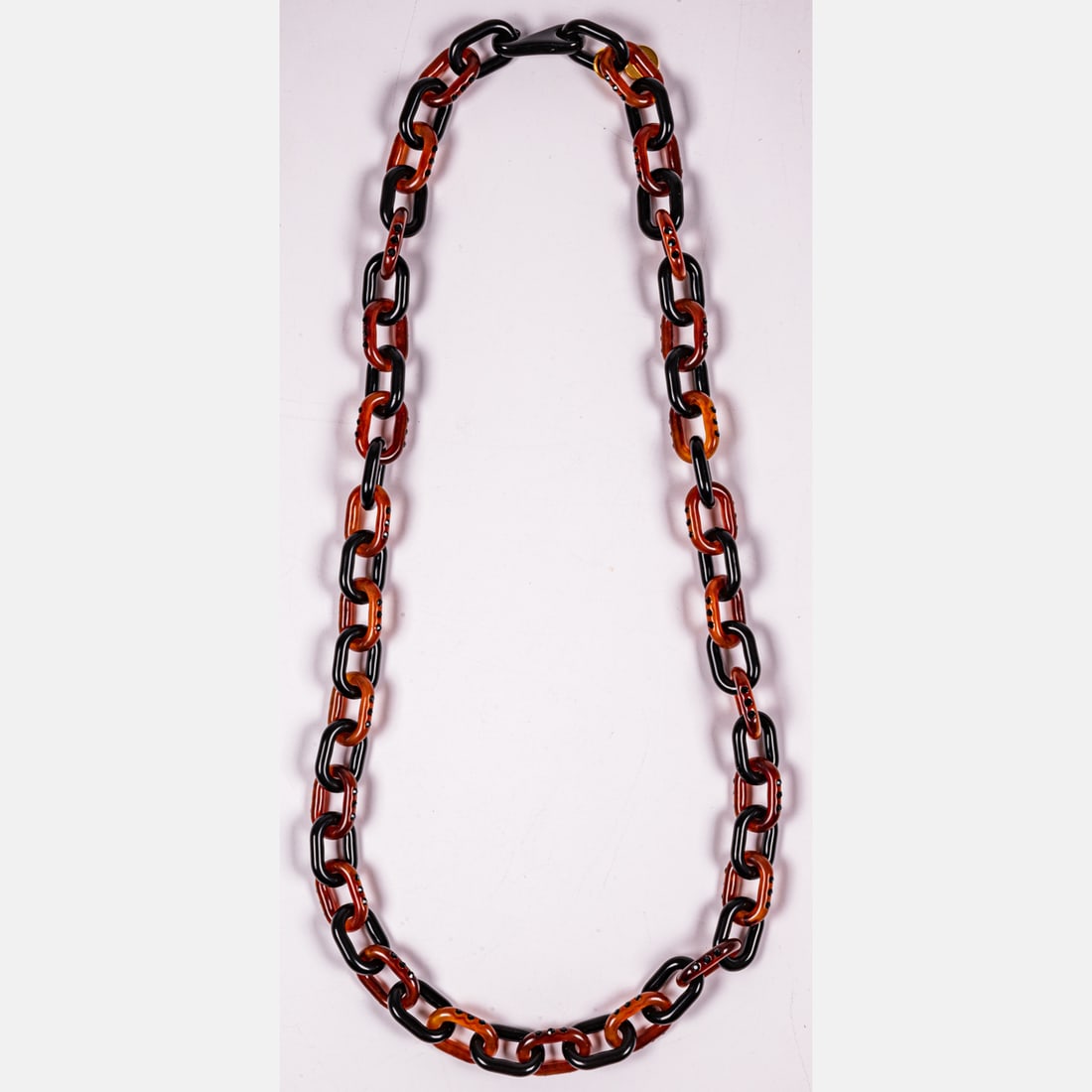 Prada Acrylic Chain: Prada Acrylic Chain Set with small black crystals. Alternating black and brown colored links. Length: 40 inches Diamer of links: approximately 7/8 inch Thickness of links: 5.7 mm Property from the Tob