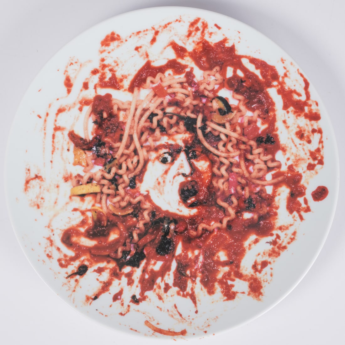 Vik Muniz (Brazilian, b. 1961): Vik Muniz (Brazilian, b. 1961) Medusa 1999, Glazed ceramic plate by Bernardaud Limoges, France, On verso: 1999 Peter Norton Family Christmas Project by Vik Muniz. Lead free, dishwasher safe. D: 12 3/8