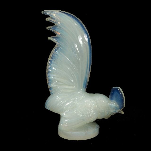 A Lalique Opaline Glass Cockerel Mascot "Coq Nain,: A Lalique Opaline Glass Cockerel Mascot ""Coq Nain,"" 20th Century, Signed at base. Dimensions: h: 8.5 x w: 5.5 x d: 2.75 in.