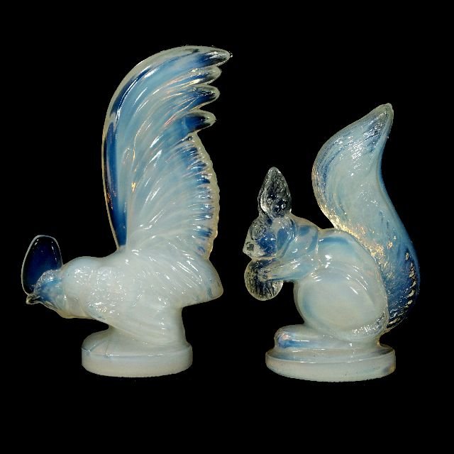 A Lalique Opaline Glass Cockerel Mascot "Coq Nain": A Lalique Opaline Glass Cockerel Mascot ""Coq Nain"" Together with a Squirrel, 20th Century, Both are paperweights. Each are signed. Largest: h: 4 x w: 2.5 x d: 1.25 in.