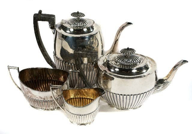 An English Sterling Silver Tea Set by W. W. Harris: An English Sterling Silver Tea Set by W. W. Harrison, Sheffield, 1899-1900, Comprising of a coffee pot, tea pot, creamer, and sugar. Approximately 56 troy oz. Largest: h: 9 x w: 10.25 x d: 3.75 in.