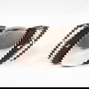 William Spratling Sterling And Wood Cuff: A William Spratling Sterling Silver And Wood Cuff Bracelet, A silver and wood cuff bracelet by William Spratling. Tiered layers of silver with wooden pieces riveted to the face of the bracelet. Marked