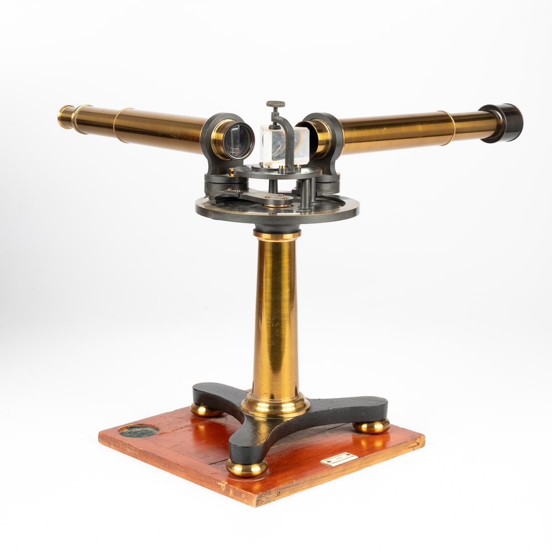 English Lacquered Brass Prism Spectroscope: An English Lacquered Brass Prism Spectroscope, signed John Browning, 63 Strand London, retailed by Brady & Martin, Newcastle-on-Tyne. With original mahogany box that measures 15 1/4 x 9 1/2 x 9 1/4 in