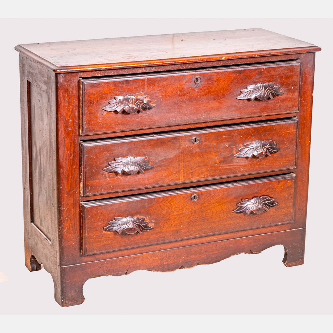 American Carved Walnut Chest of Drawers: An American Carved Walnut Chest of Drawers, 19th Century. H: 33 1/2 W: 40 D: 17 1/4 in. From the Estate of John A. Davidson, Jr. Proceeds to benefit the APL of Lorain County and the Dittrick Museum. W