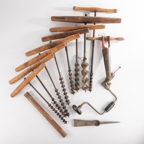 A Collection of Antique Metal and Wood Auger Tools, Hand Drill, and Pickax