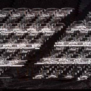 Twenty Coca-Cola Glasses: A Collection Of Twenty Glass Coca-Cola Glasses, 20th Century, Denoting Drink Coca-Cola and Enjoy Coke. Tallest dimension: H: 5 in. From a private NE Ohio single-owner collection. Proceeds to benefit t