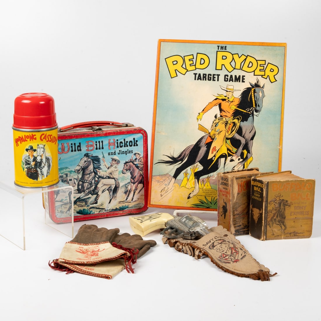 Famous Cowboy Character Memorabilia: A Collection of Famous Cowboy Character Memorabilia, Including: Red Ryder target game; Davy Crockett toy pistol and holster; Red Ryder gloves; Wild Bill Hickok lunch box and Hopalong Cassidy thermos;