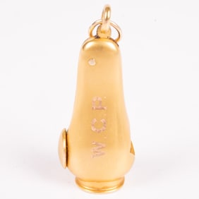 A Yellow Gold and Metal Cigar Cutter Fob