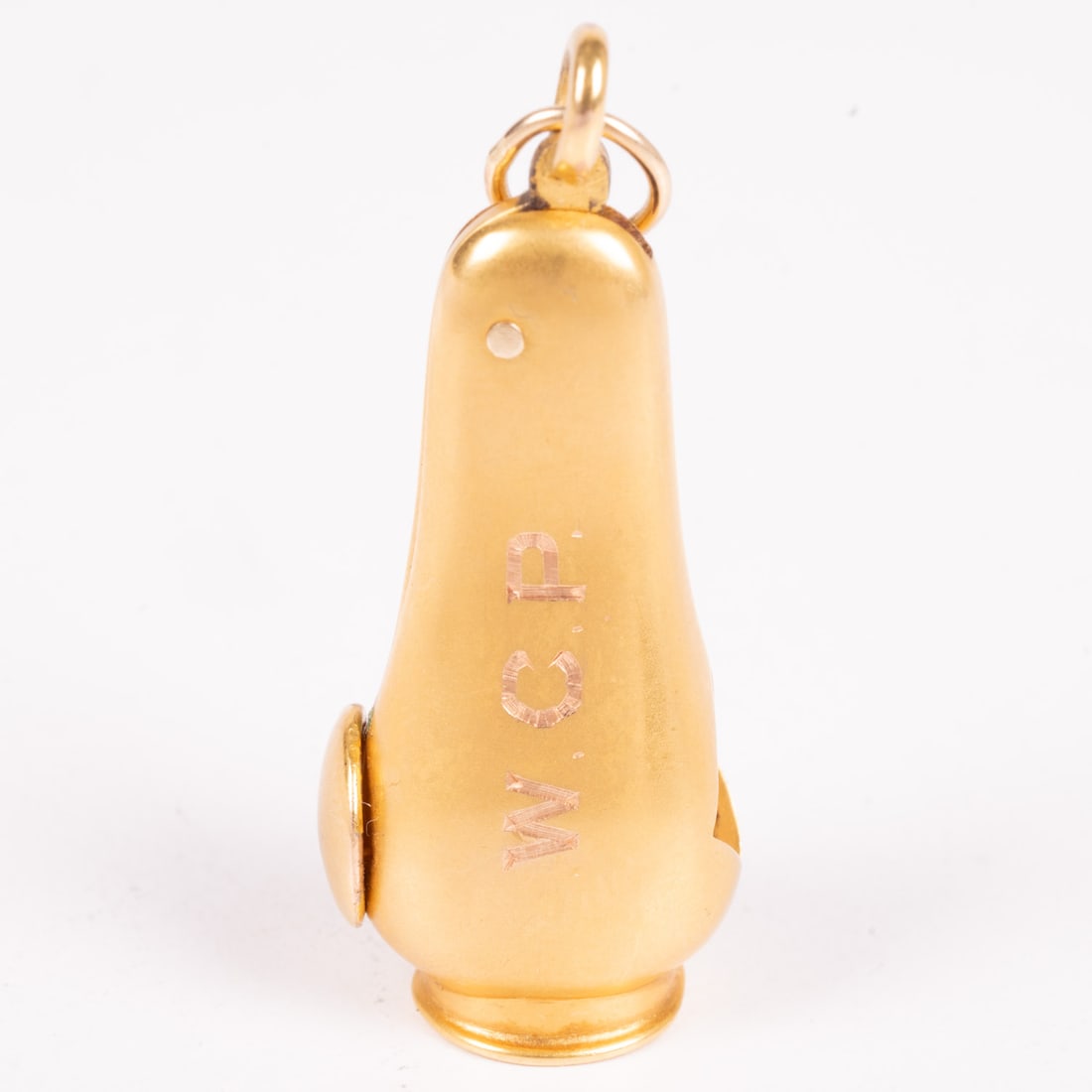 A Yellow Gold and Metal Cigar Cutter Fob: A Yellow Gold and Metal Cigar Cutter Fob. Marked 14. Monogrammed W.C.P. Not able to accurately weigh gold. L: 1 1/2 W: 1/2 in. From a Northeast Ohio Collector.