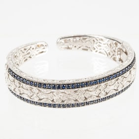 A Sterling Silver Sapphire and Diamond Hinged Cuff Bracelet.