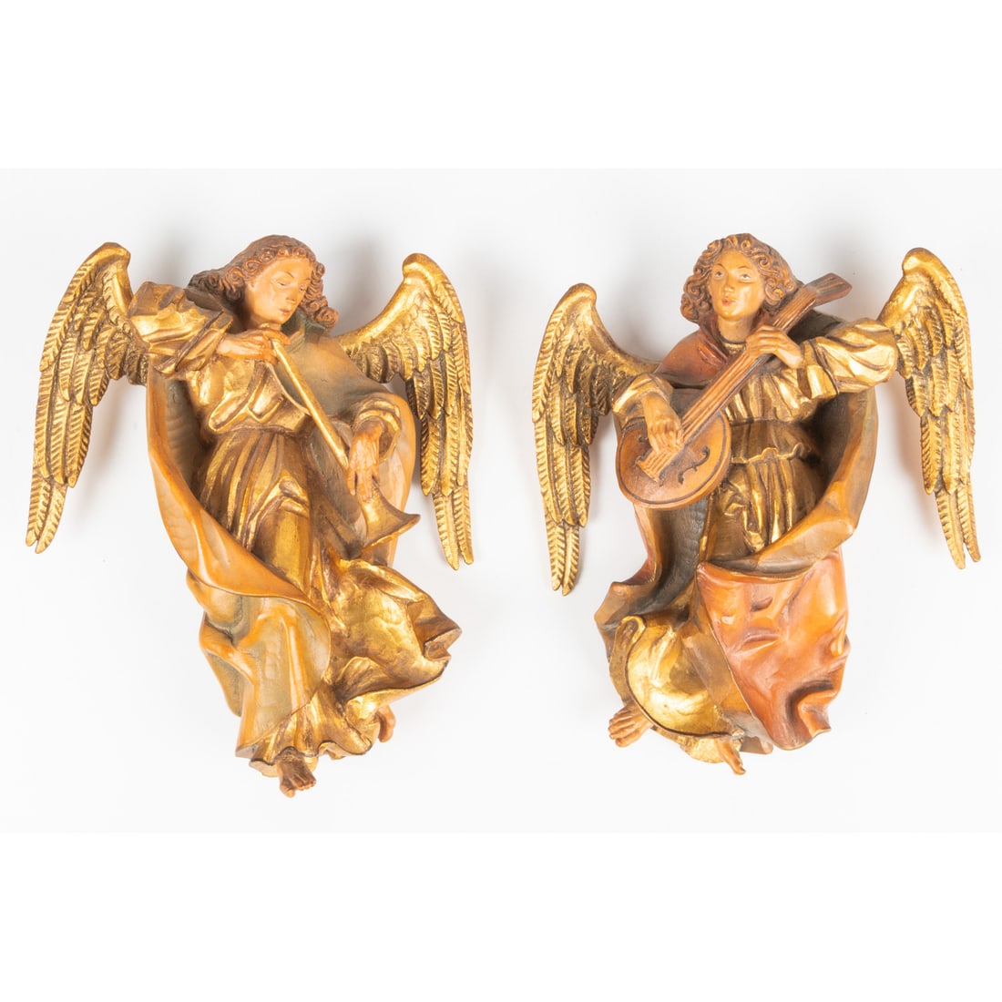A Pair of Amri Hand Carved Wood Angels: A Pair of Amri Hand Carved Wood Angels, , 20th Century. Playing musical instruments. Each dims: H: 8 x W: 6 1/2 in. From a Northeast Ohio Collector.