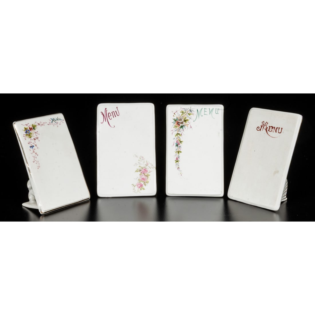 Four French Porcelain Menu Plaques: Four French Porcelain Menu Plaques, 20th Century, Having hand painted and transfer printed floral decorations, with one having gilt highlights and Limoges maker's mark to the underside. Largest dims: