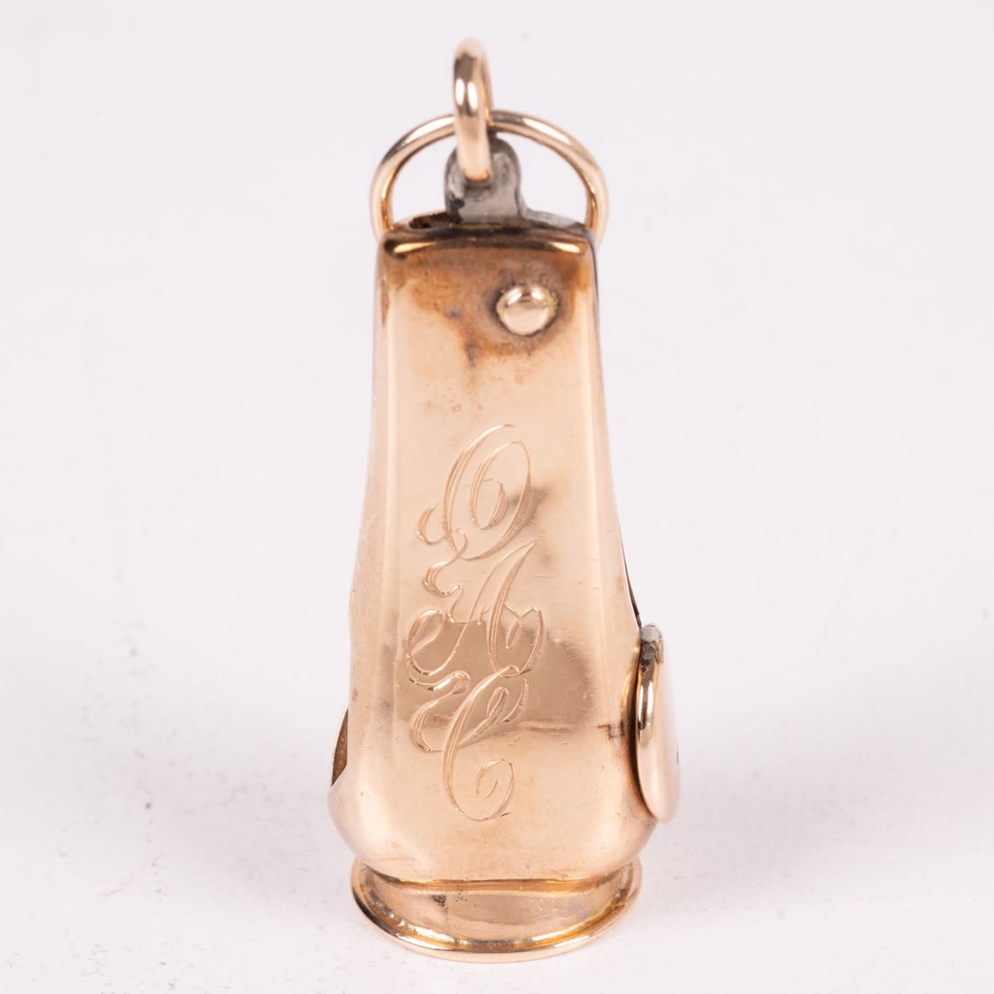 A 10 Kt. Yellow Gold and Metal Cigar Cutter Fob: A 10 Kt. Yellow Gold and Metal Cigar Cutter Fob. Marked 10 K A. With monogram O.A.C. Not able to accurately weigh gold. From a Northeast Ohio Collector.