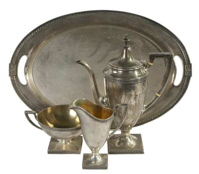 A Gorham Sterling Silver Four Piece Tea Set: A Gorham Sterling Silver Four Piece Tea Set in the Etruscan Pattern, 20th Century. Comprising of a tea pot, creamer, open sugar, and tray. Teapot dimensions: h: 9.75 x w: 7.25 x d: 3.5 in. Total appro