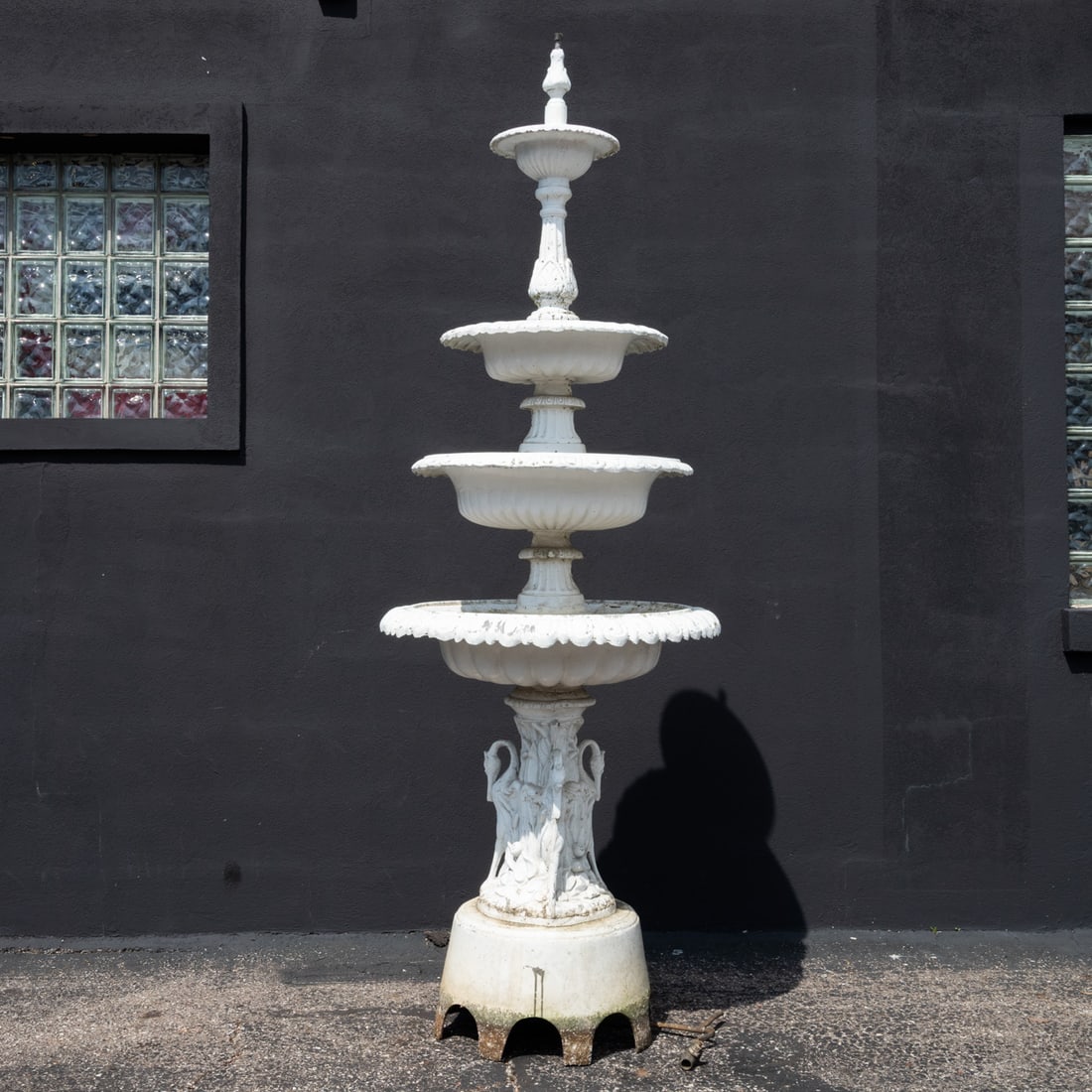 Four Tier Cast Aluminum Fountain: A Four Tier Cast Aluminum Fountain, 20th century, with swan motif at base, painted white and fitted for propane. H: 96 D: 34 in.