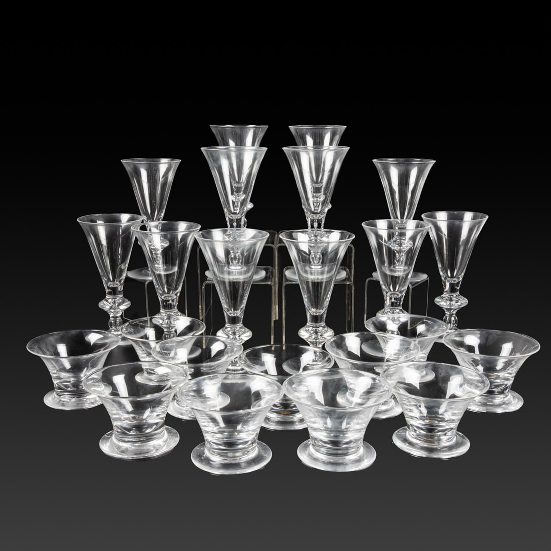 Steuben Glass Goblets: A Set of 12 Steuben Glass Goblets, No. 7737, with original boxes and felt bags, together with a set of 12 Steuben seafood / fruit bowls, No. 7766, also with original boxes and felt bags. Goblet: 7 1/4