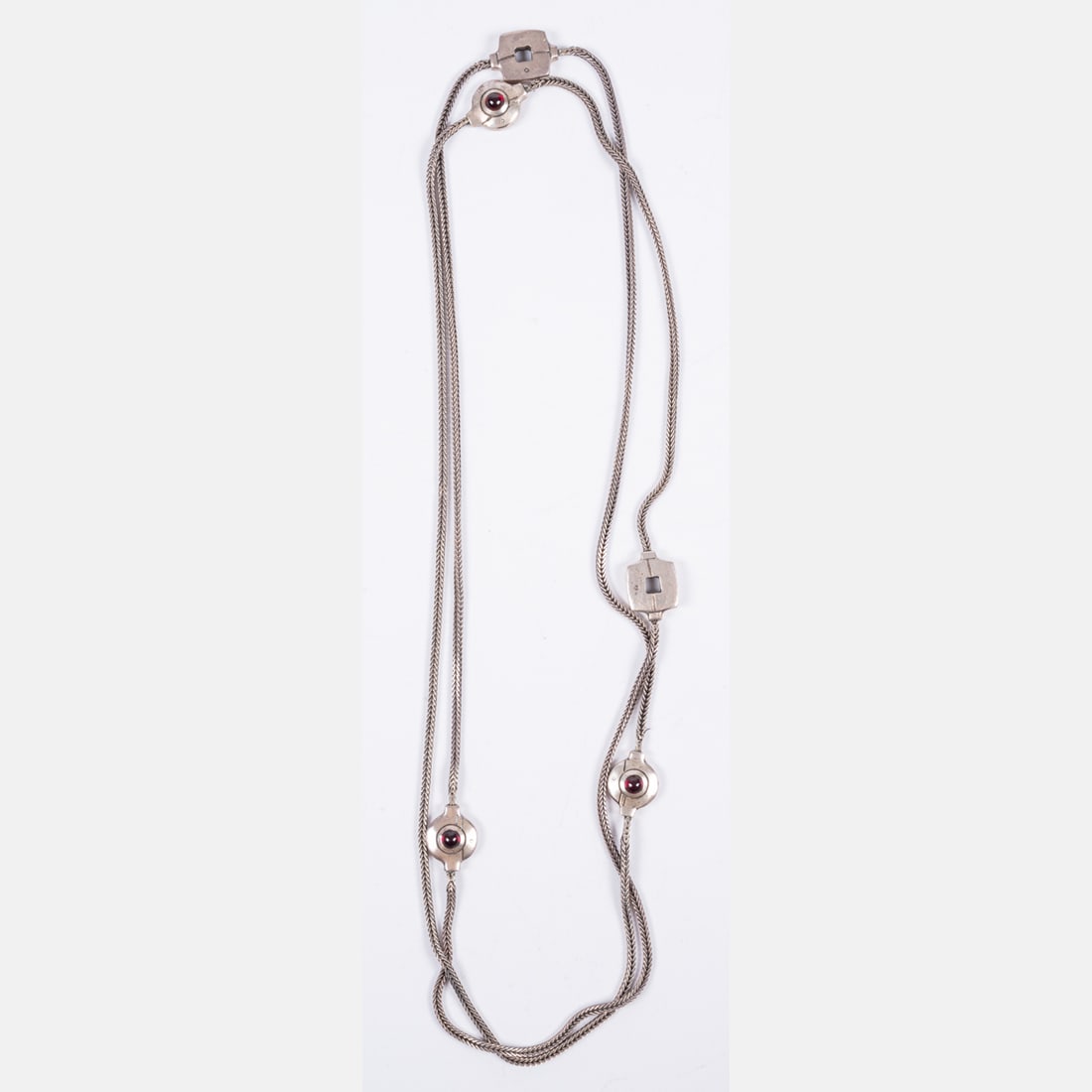 Lisa Jenks Sterling Silver Station Necklace: A Lisa Jenks Sterling Silver Station Necklace, A necklace attributed to Lisa Jenks featuring a long, woven square-shaped silver chain with five abstract and geometric station charms, three of which ar