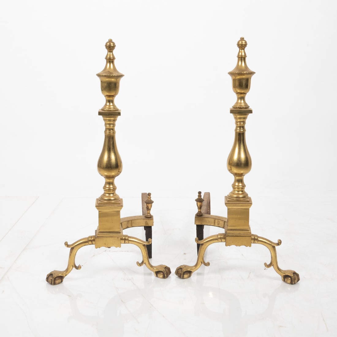 Pair of Federal Style Brass Andirons: A Pair of Federal Style Brass Andirons, 20th Century. H: 24 W: 12 1/2 D: 22 in.
