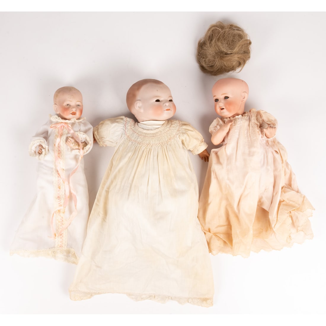 Three Bisque Porcelain Baby Dolls: Three Bisque Porcelain Baby Dolls, 19th Century, Comprising: Two marked Germany One marked Nippon Largest is 14 in. From the collection of a Northeast Ohio collector.