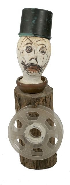 Reverend Albert Wagner (1924 - 2006) Untitled, Assemble: Reverend Albert Wagner (1924 - 2006) Untitled, Assembled sculpture, Comprising of a log with a plastic spool, styrofoam head form, and other found objects. Dimensions: h: 30.5 x w: 10 x d: 8 in. *** P