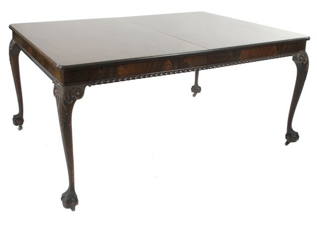 A Georgian Style Mahogany Dining Table, 20th Century,: A Georgian Style Mahogany Dining Table, 20th Century, Together with five leaves. Dimensions: h: 29.5 x w: 60 x d: 45 in. *** Please inquire for shipping estimate prior to bidding. Shipping costs may e