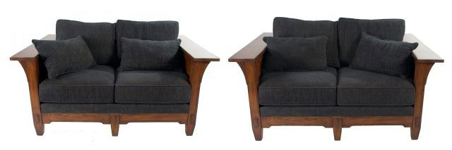 A Pair of Arts and Crafts Stained Hardwood Settees, 20t: A Pair of Arts and Crafts Stained Hardwood Settees, 20th Century. Dimensions: h: 29 x w: 65.5 x d: 44 in. *** Please inquire for shipping estimate prior to bidding. Shipping costs may exceed item valu