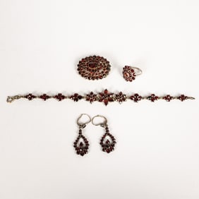 A Suite of Russian Silvered Metal and Garnet Jewelry