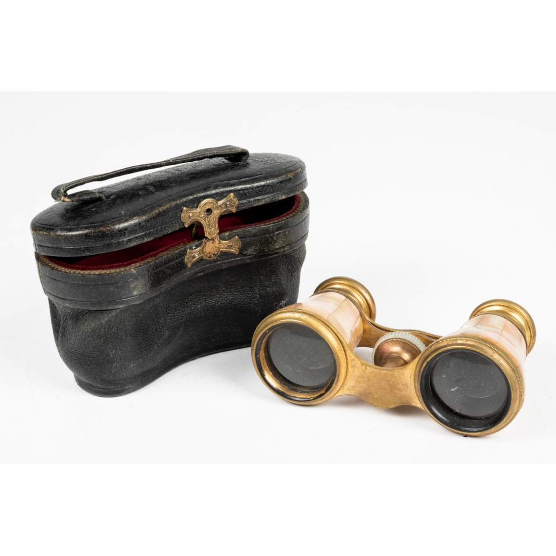 A Pair of Verdi, Paris, Mother of Pearl Opera Glasses: A Pair of Verdi, Paris, Mother of Pearl Opera Glasses, 19th Century, With Satin Lined Leather Case, makers marked etched on eye pieces. H: 3 W: 4 1/2 D: 2 in. From a Northeast Ohio Collector.