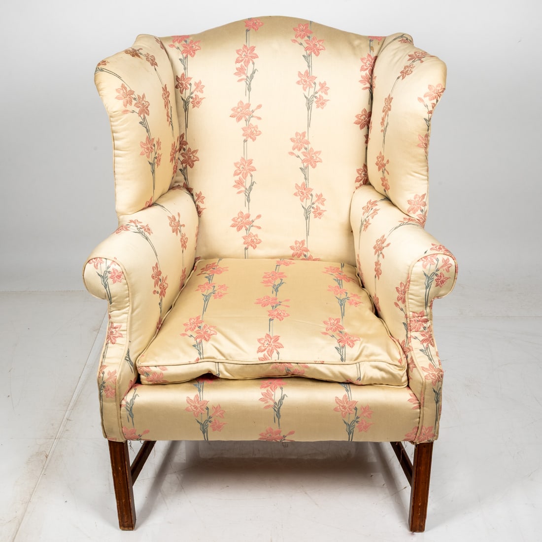 A Georgian Style Mahogany Wing Chair: A Georgian Style Mahogany Wing Chair, 20th c., Upholstered in silk. H: 44 W: 34 D: 26 in.