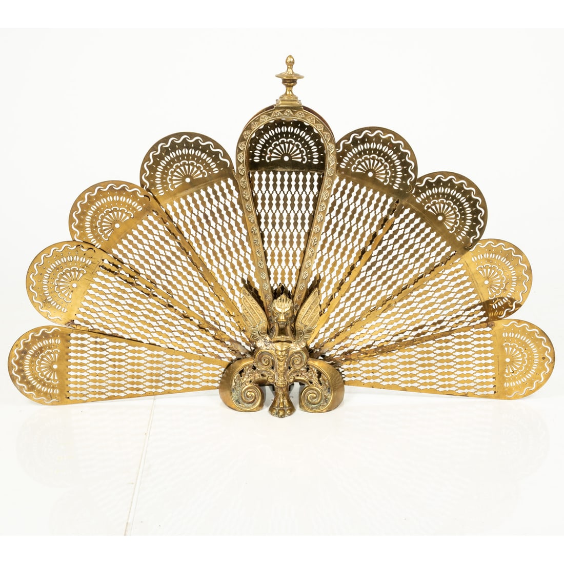 A Pierced Brass Fan Form Fire Screen With Winged Griffin Motif (1 of 4)