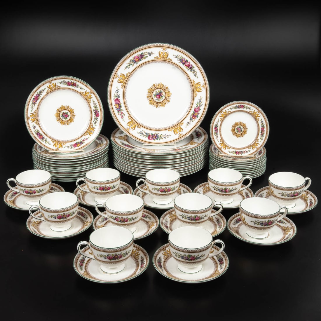 Wedgwood Columbia Dinner Service: 58 Piece Wedgwood Columbia Dinner Service, 20th Century Bone china, comprising: Eleven plates 11 in. Twelve plates 8 1/4 in. Twelve plates 6 in. Twelve cups 3 1/4 in. Eleven saucers 5 3/4 in. From the