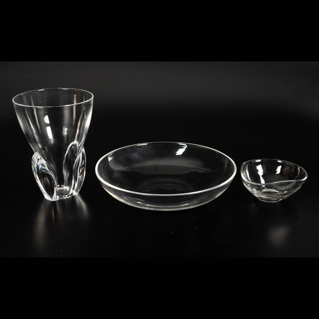3 Glass Decorative Objects: Three Glass Decorative Objects, 20th Century. Comprising a Steuben vase and a large Steuben bowl, plus an small unsigned bowl. Bowl.: H: 2 1/2 x Dia: 11 in. The collection of an Ohio family.