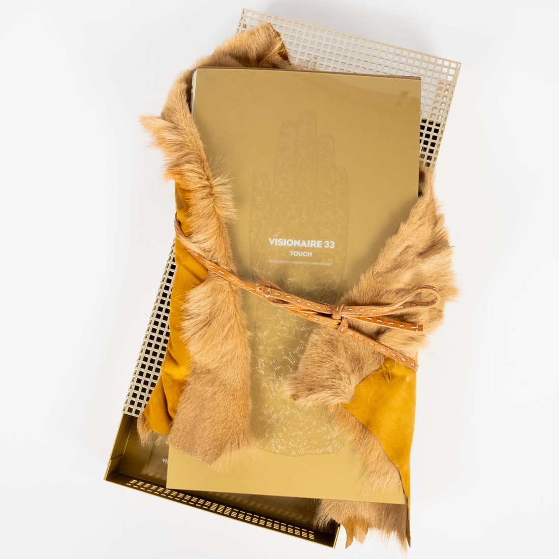 Visionaire Issue 33: Touch Fendi: Visionaire Issue 33: Touch Fendi. Edition 698/4400. Visionaire Publishing Ltd., New York, 2000. 20 loose plates, pony fur, pierced brushed metal box. "In 33 TOUCH, artist and longtime Visionaire contr