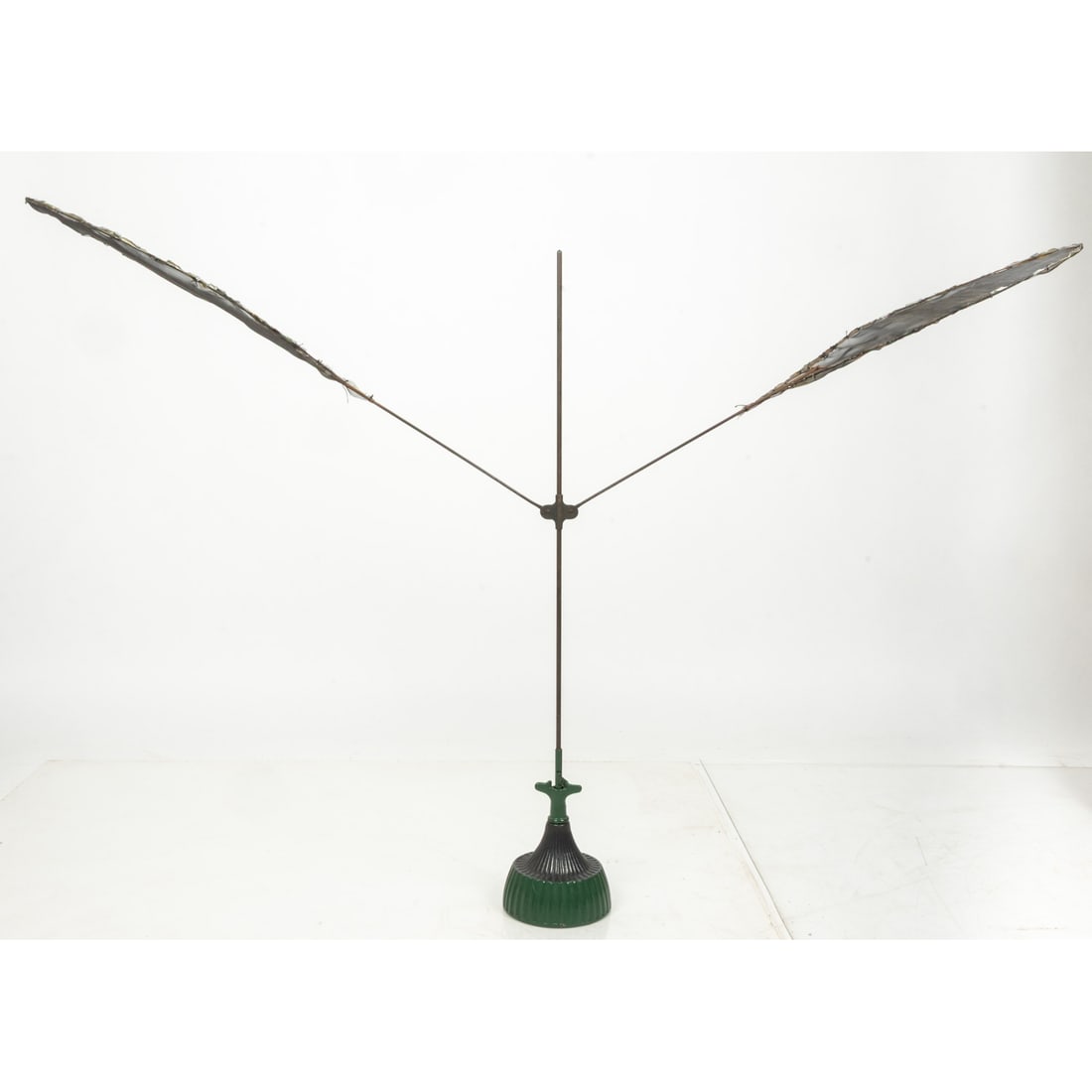 Shoo-Fly Mechanical Fan Fly Swatter: Shoo-Fly Mechanical Fan Fly Swatter, 19th Century Circa 1877 Victorian mechanical fly swatter with a green painted base and mesh arms. A clockwork windup mechanism raises the arms, and when it drops,
