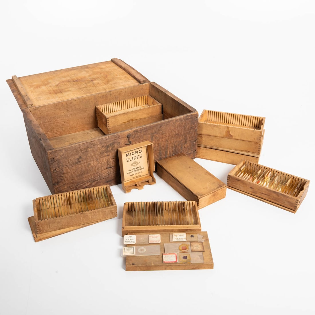 100 Specimen Slides and Cases: 100 Specimen Slides and Cases, 20th Century, Microscope slide topics are human, botanical and animal. Four boxes of 25 slides, plus additional boxes with and without lids. Many are from former