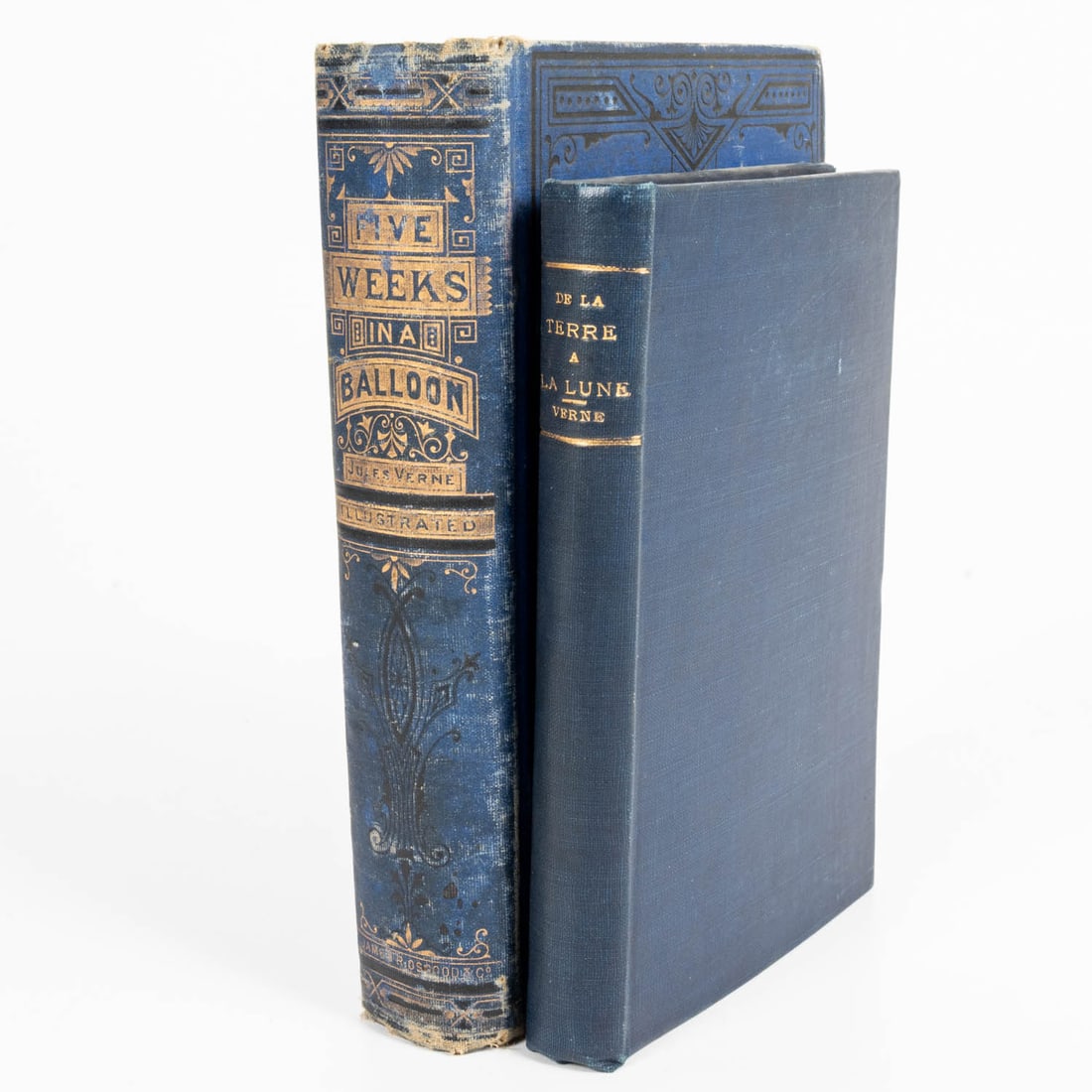 VERNE, Jules. De La Terre a la Lune; and Five Weeks in a balloon.: VERNE, Jules (1828-1905). De La Terre a la Lune (French); and Five Weeks in a balloon (English). Publisher of De la Terre:J. Hetzel, Paris. N.D. 6th edition. Blue cloth, with gilt title on spine.