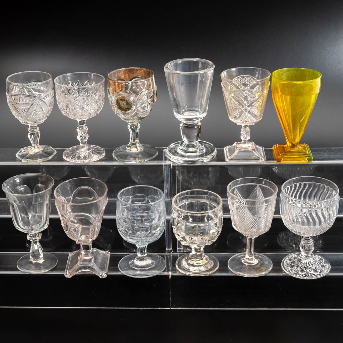 12 EAPG Pressed Glass Goblets: Twelve American Pressed Glass Goblets, 19th/20th Century, Having two, three (tri-mold) or four mold joints. Patterns Comprising: Barrel (old) Argus, 1840s; Bulle's Eye & Daisies, 1880s; Early