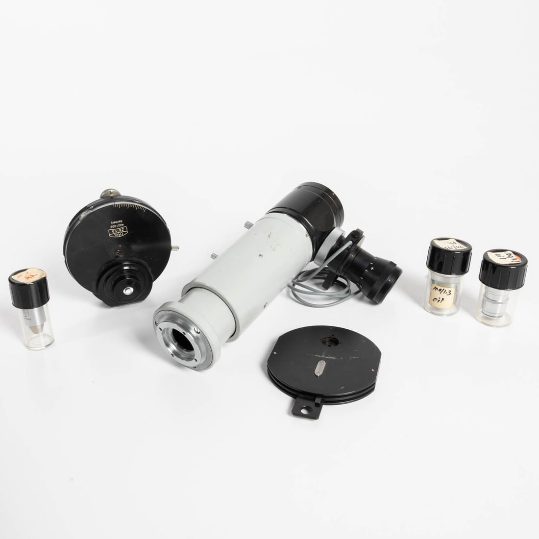 Group of Zeiss Microscope Attachments: Group of Zeiss Microscope Attachments, 20th Century, German, Zeiss photo microscope attachment, a phase contrast condenser model 4221359; and Zeiss objective lenses of assorted magnifications. 