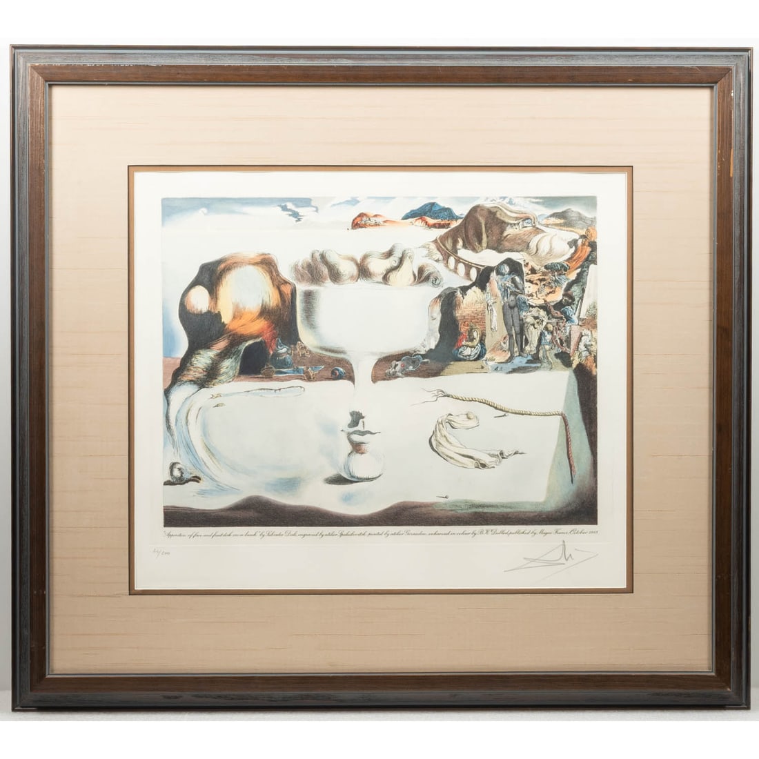 Salvador Dali (1904-1989): Salvador Dali (1904-1989) Apparation of Face and Fruit Dish on a Beach, Colored Etching on Arches Wove Paper, #44/200. Signed LR. With C.O.A. from Cass Publishing. Image: H: 15 X W: 20 in. H: