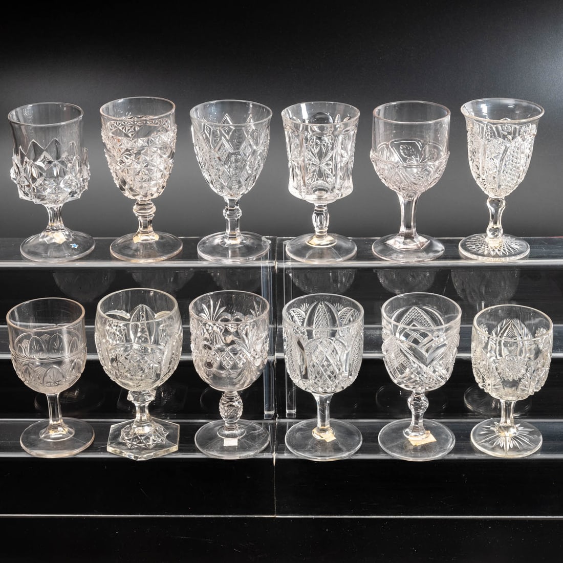 12 EAPG Pressed Glass Goblets: Twelve American Pressed Glass Goblets, 19th/20th Century, Having two, three (tri-mold) or four mold joints. Comprising: Tiden, 1880s; Atlanta, 1880s; Bismarc, 1885; Daisy, 1880s; Dodo, 1870s; Franklin