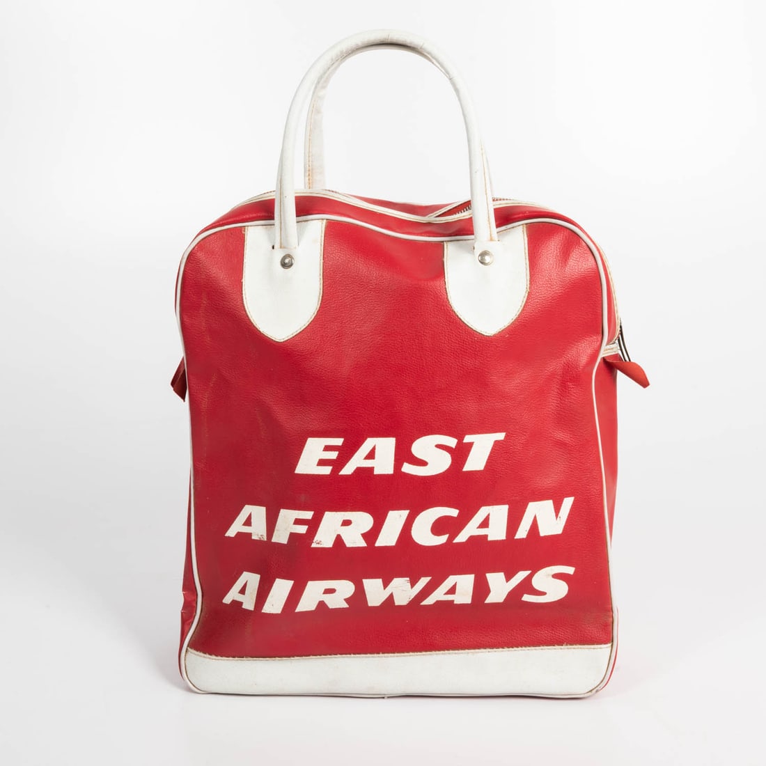 Vintage East African Airways Vinyl Travel Bag: A Vintage East African Airways Vinyl Travel Bag, ca 1960's. H: 181/4 in. including handles. H: 13 1/2 W: 12 D: 4 1/4 in.